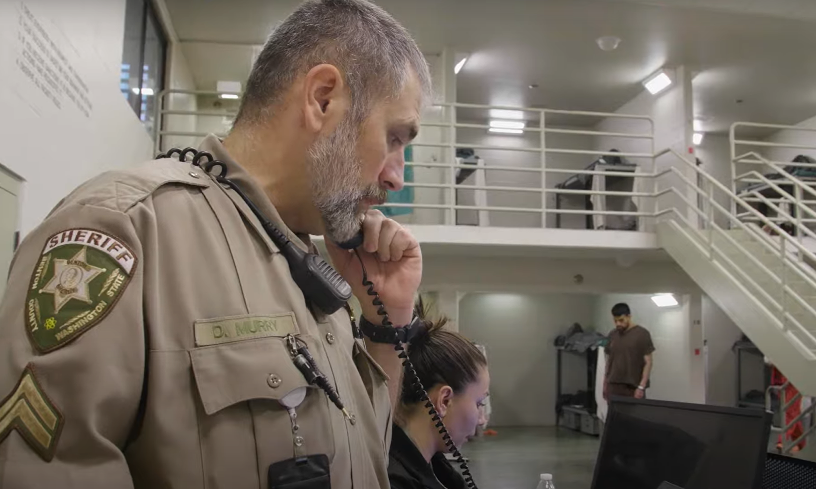 corrections officer on phone