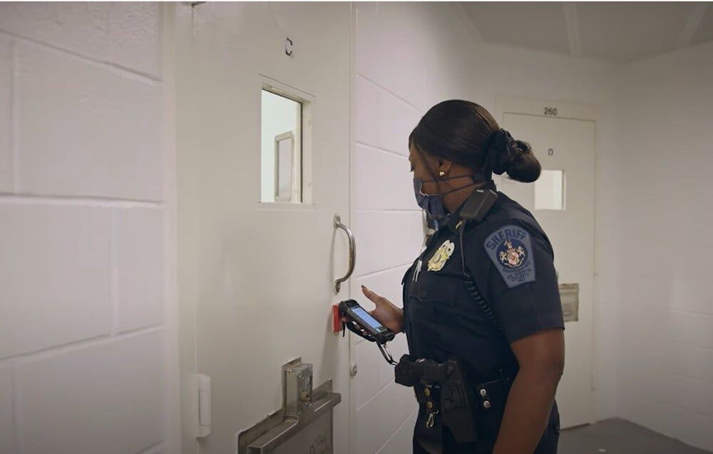 correctional-officer-scanning-rfid-hard-tag-during-security-rounds-1