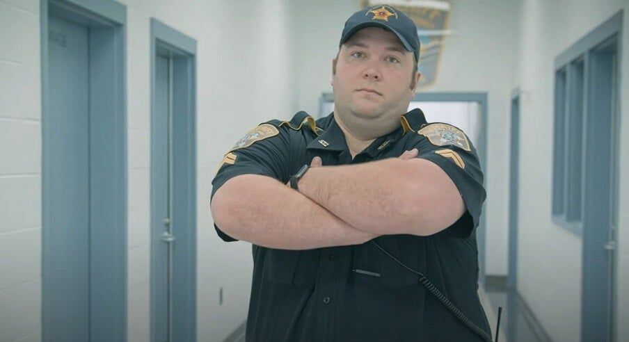 correctional-officer-with-his-arms-crossed