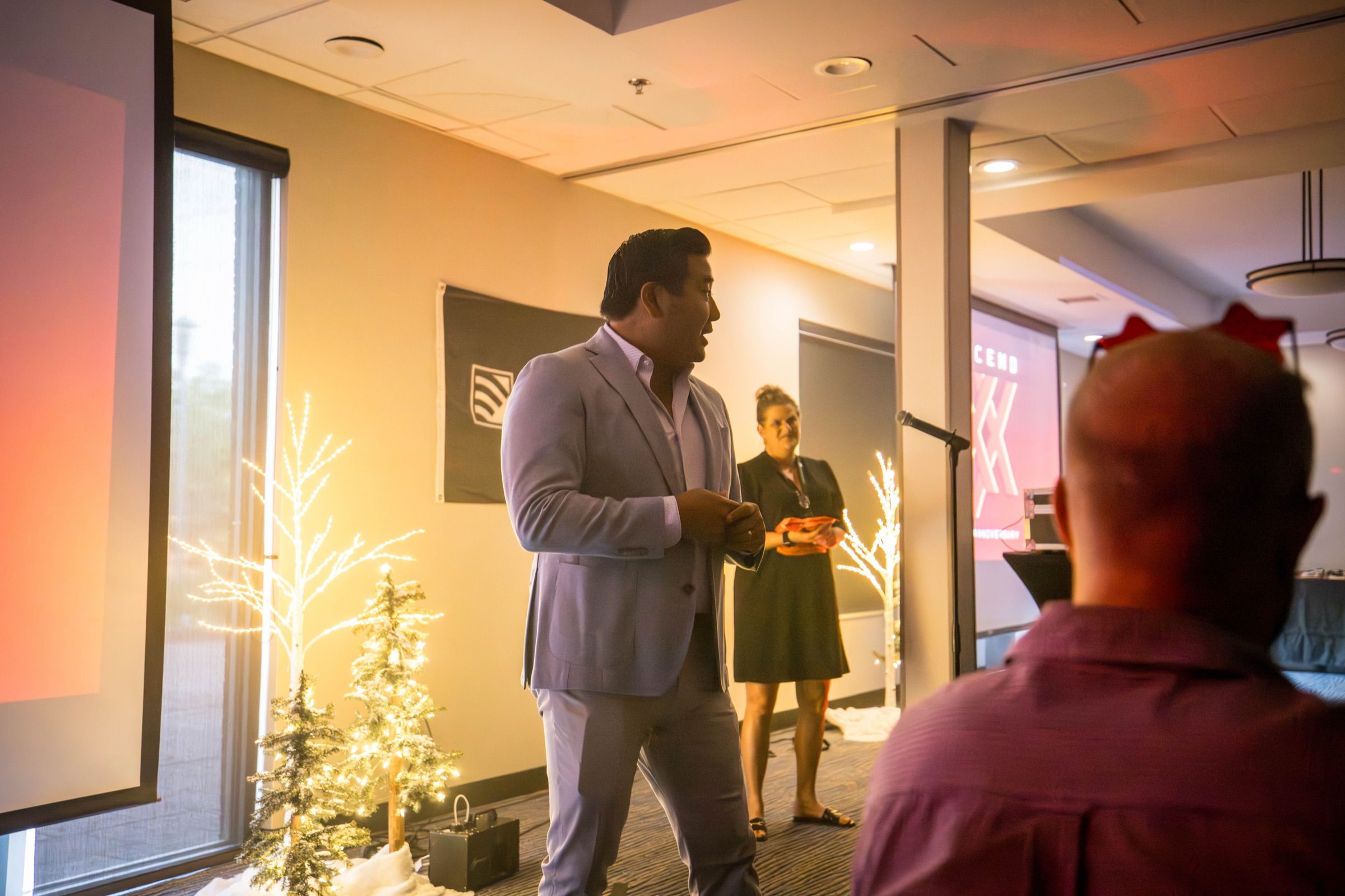GUARDIAN RFID founder Ken Dalley speaking to a seated audience at a company event