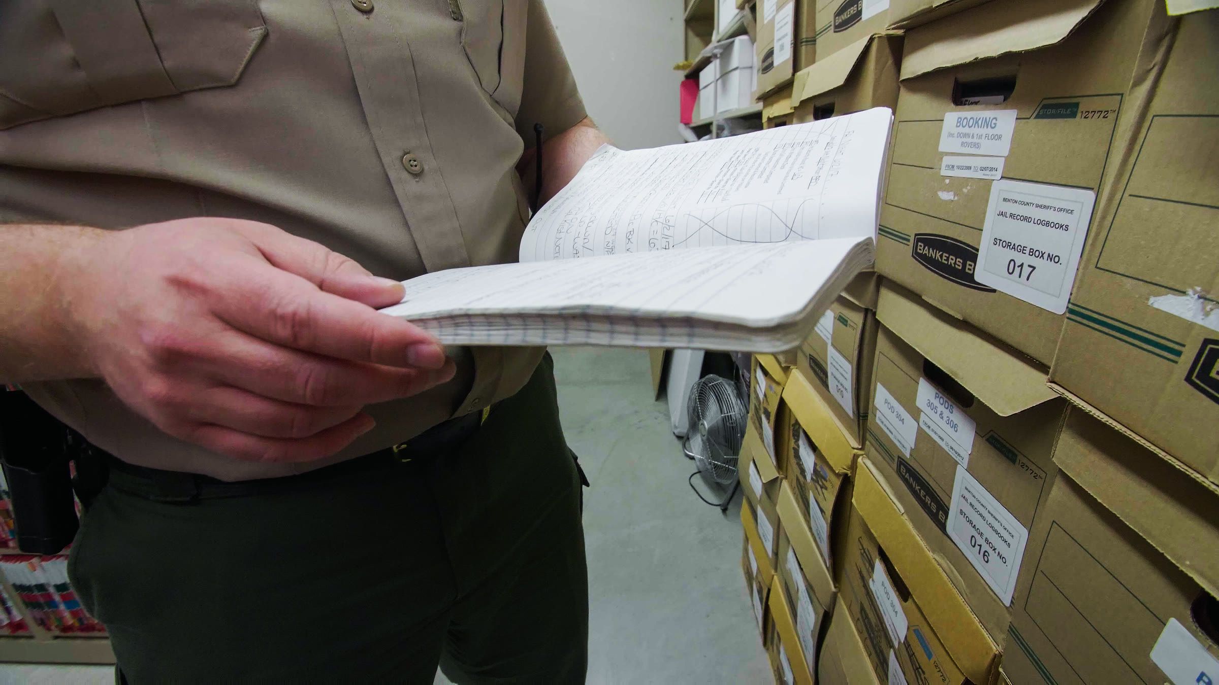 paper logbooks inside a jail