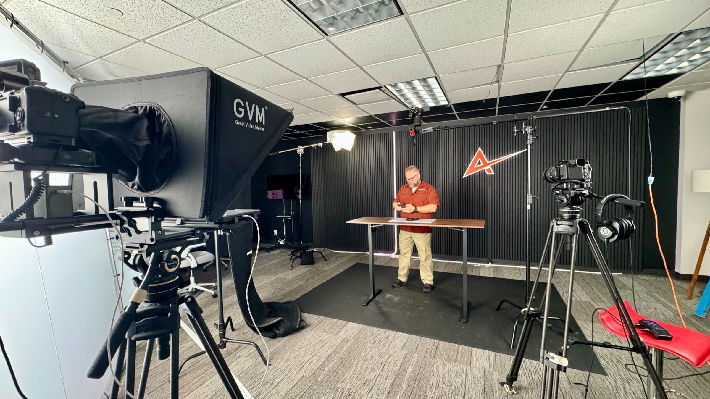 GUARDIAN RFID studio set where corrections videos are produced, with a presenter at the desk and cameras and lighting in place