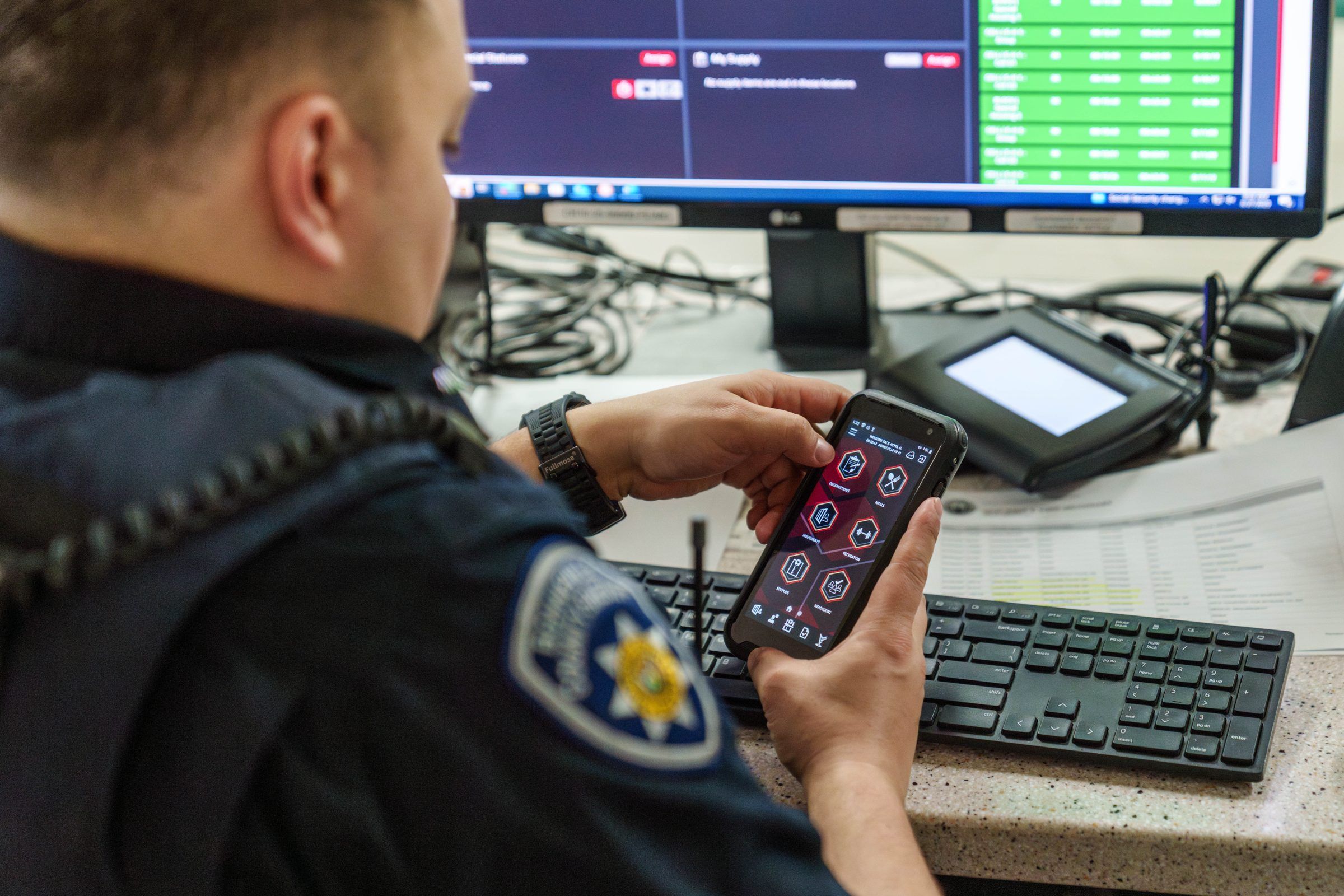 Corrections officer using Command Cloud inmate management software