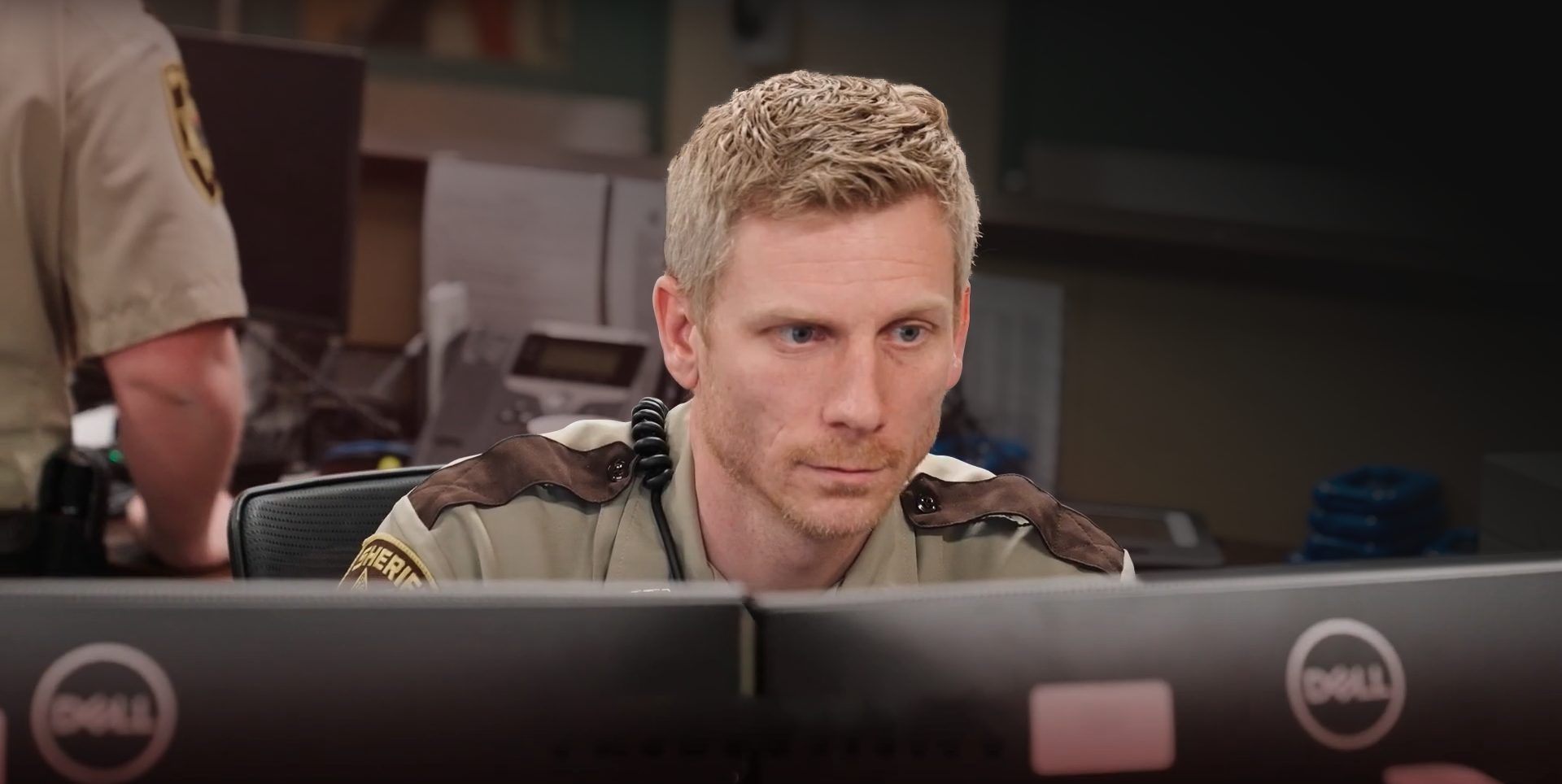 Corrections officer using Command Cloud at a desk