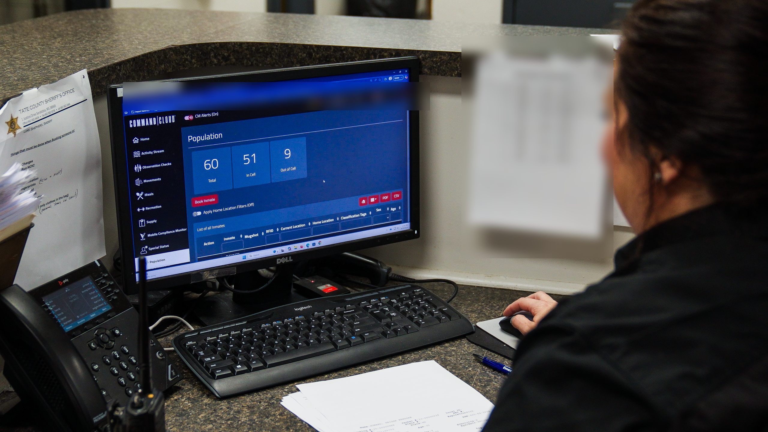 Corrections officer checking facility population in Mission Command