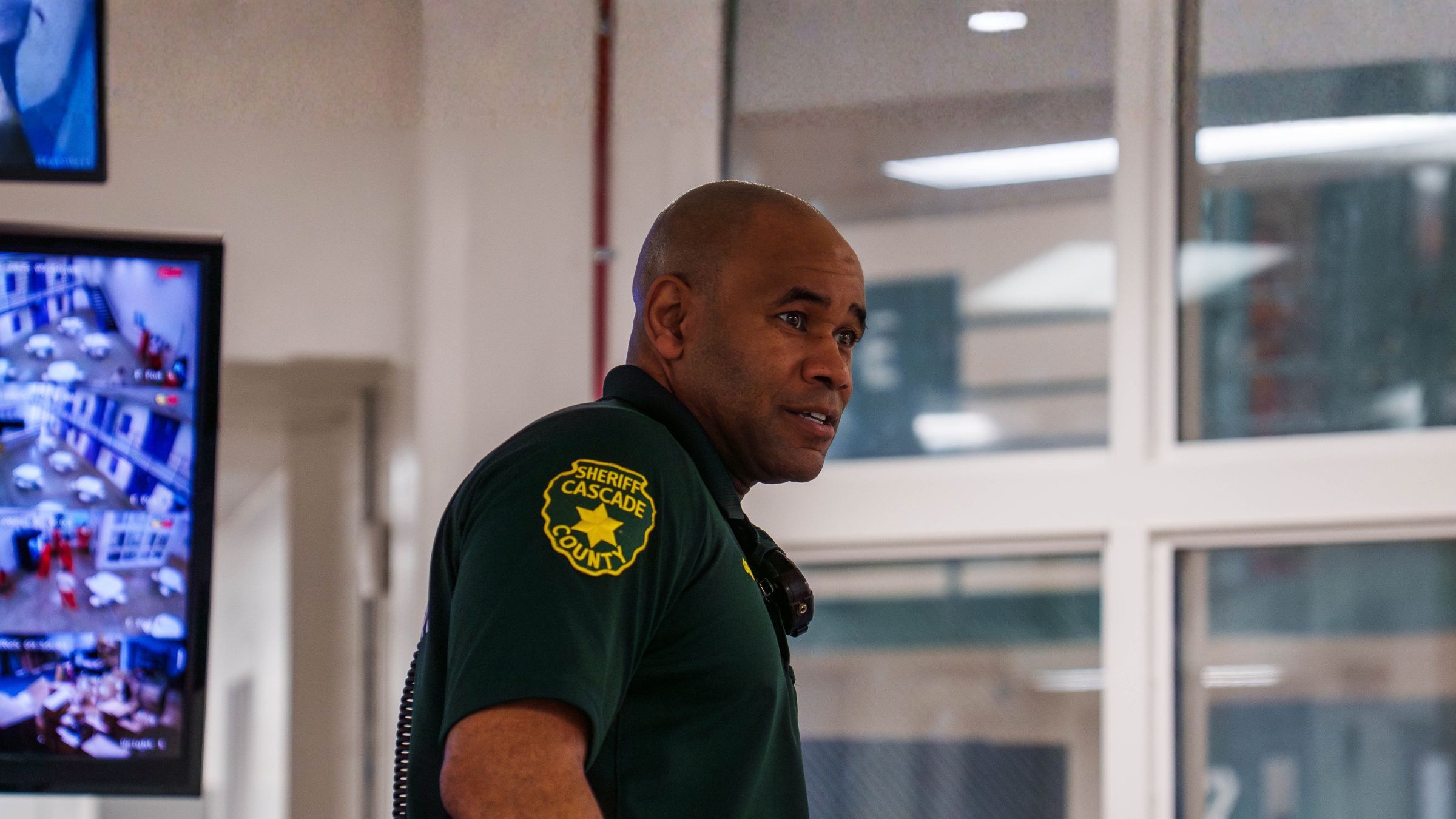 Officer monitoring Command Cloud in a jail control room