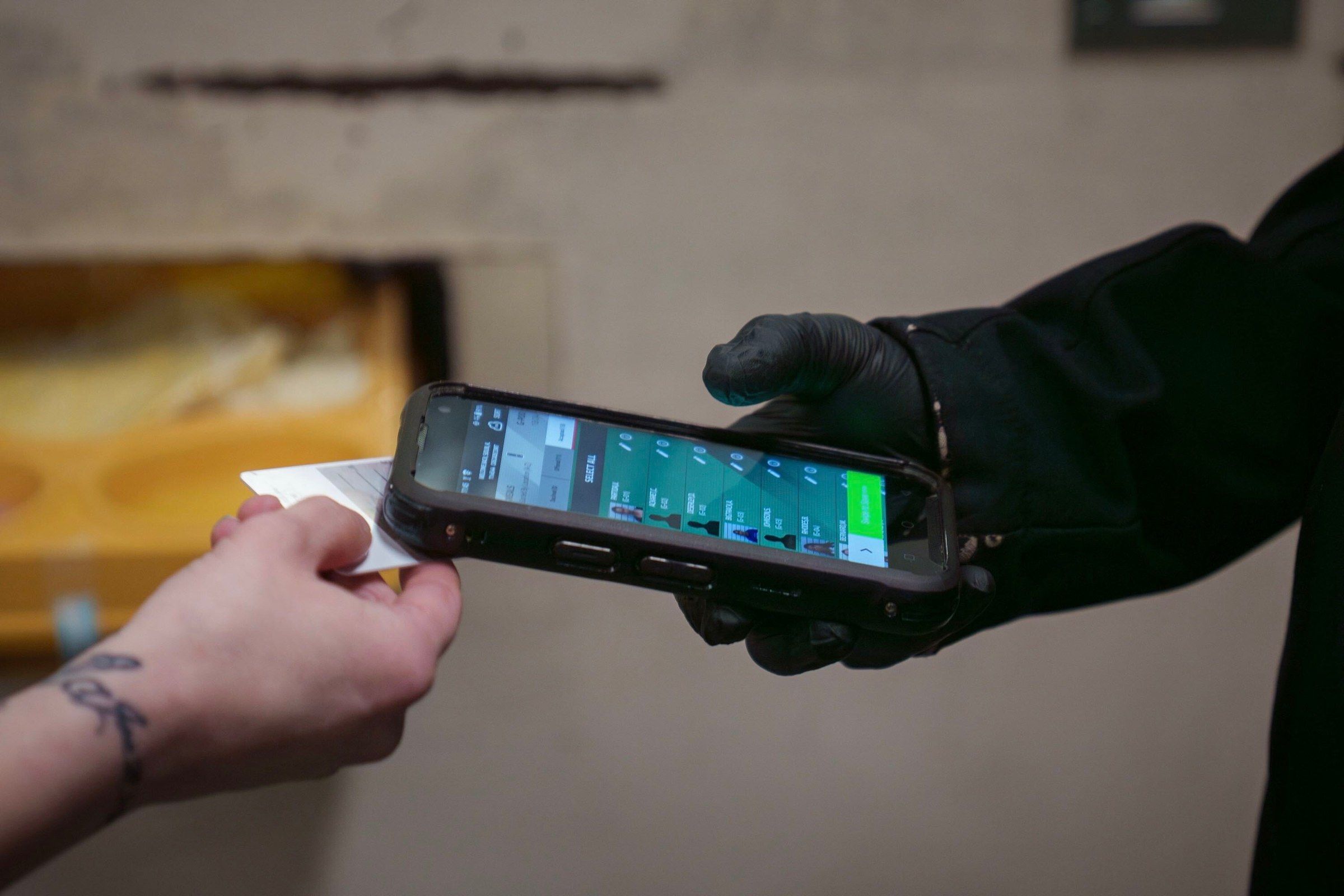 Officer scanning an inmate RFID card at the meals module