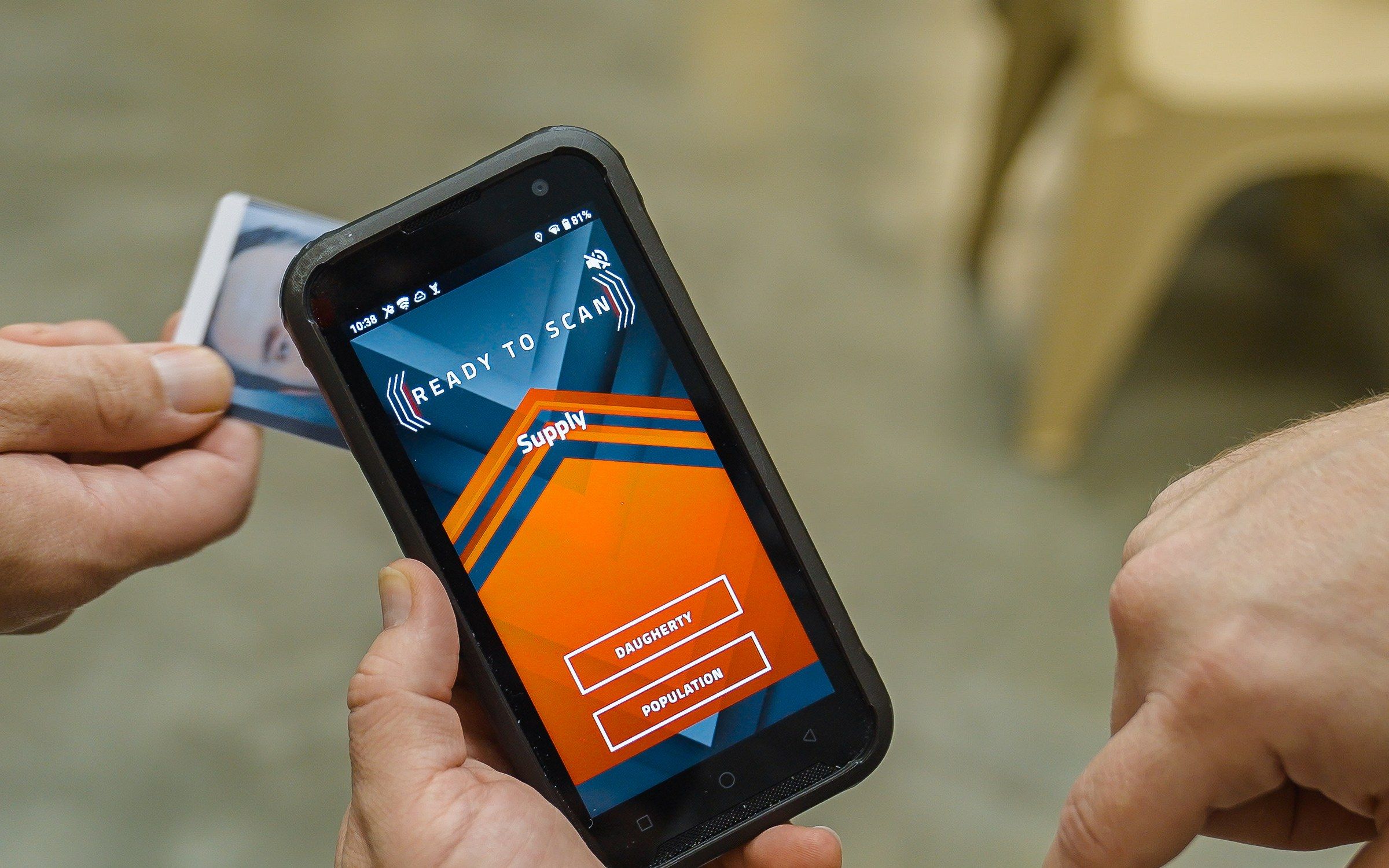 Officer scanning an inmate ID card at the supply module