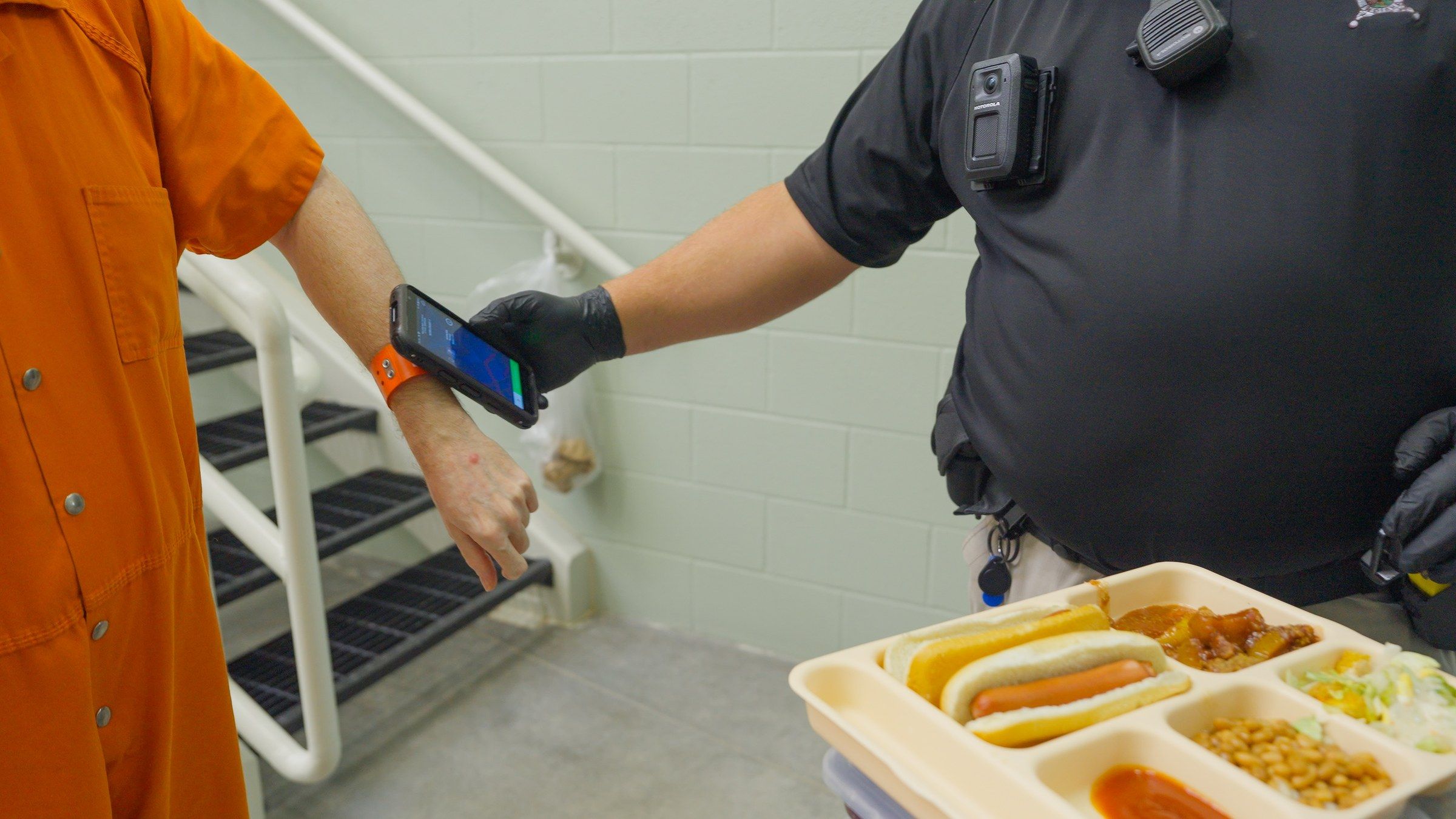 Officer scanning an inmate wristband during meal pass